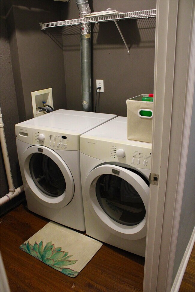 A washer and dryer are included in the unit. - 7837 Heaton Way