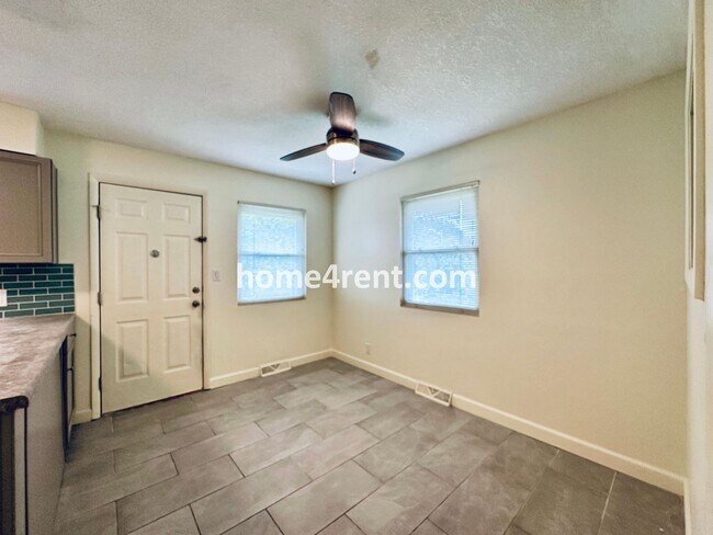 Building Photo - Olathe Duplex w/ Wood Floors, Finished Basement, and a Fenced Yard!