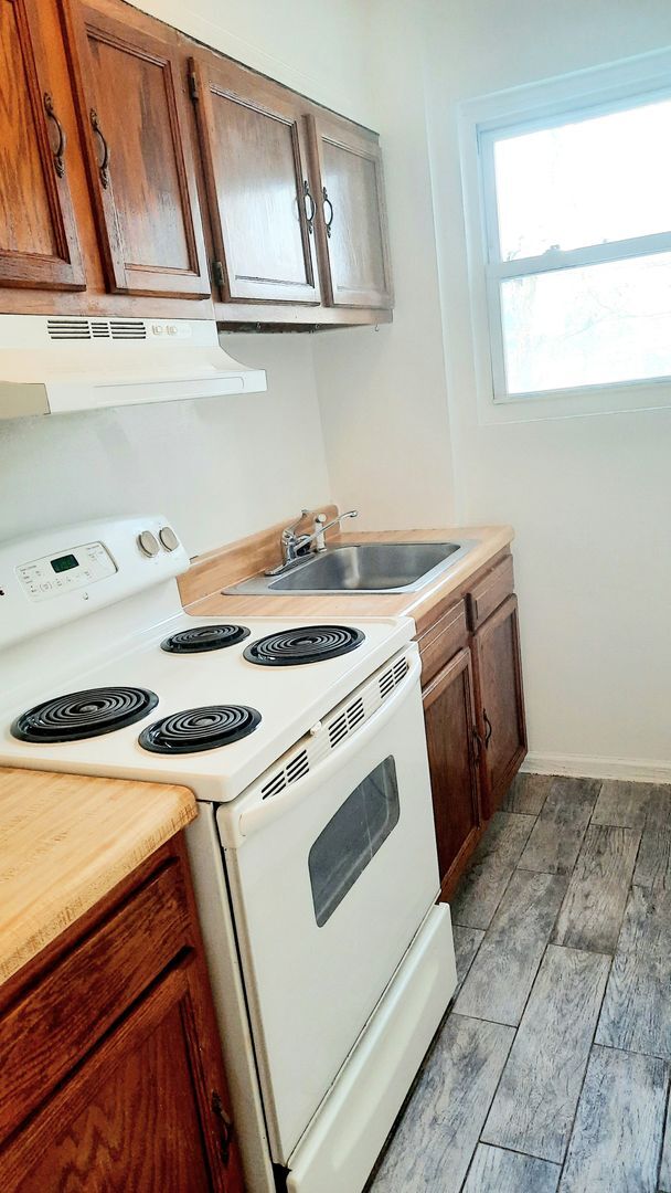 Building Photo - NOW LEASING AT BUNKER HILL FLATS!