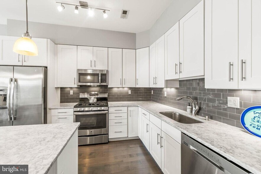 More cabinet storage! Plenty of room in the kitchen for cooking with multiple people - 3821 14th St NW
