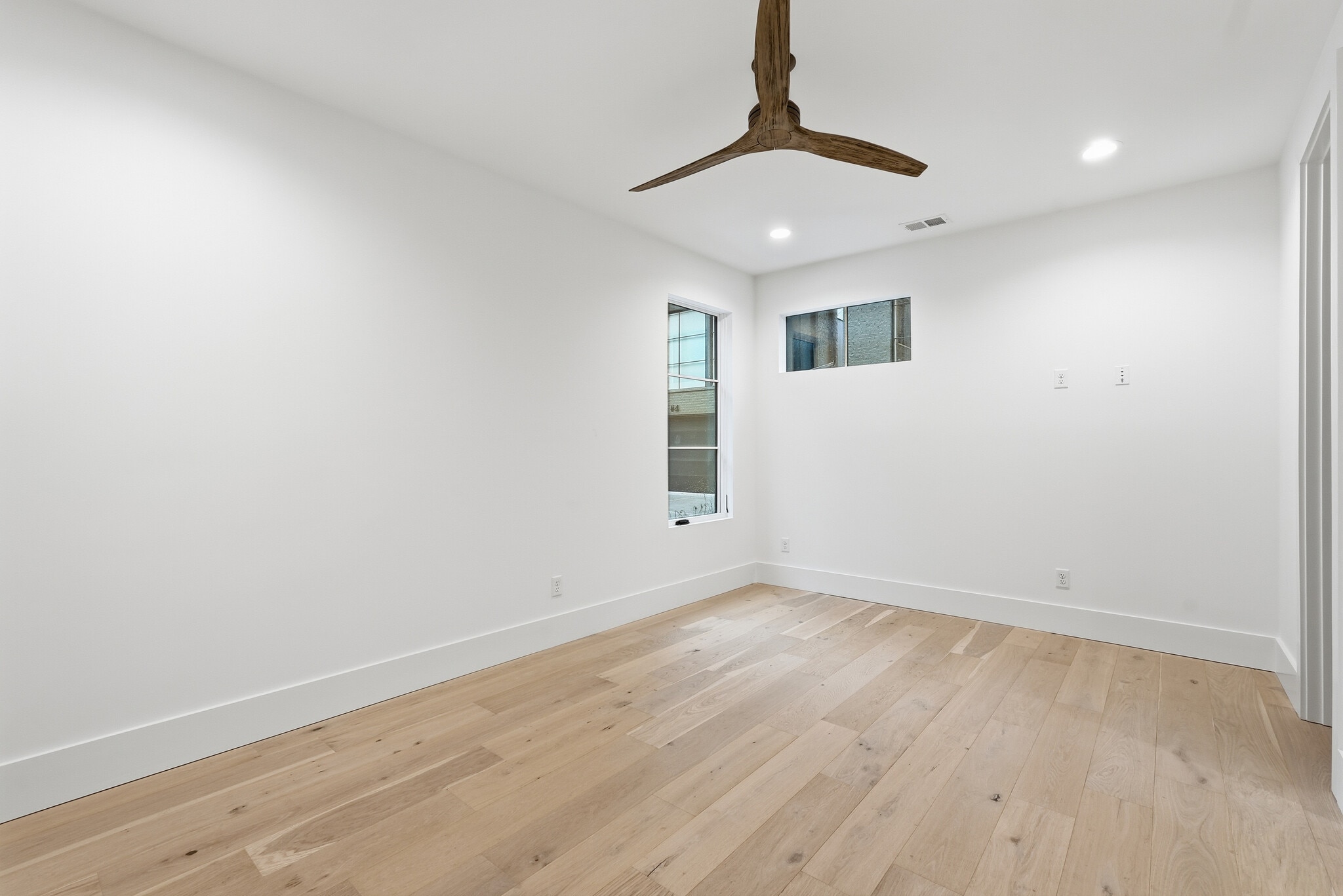Spacious bedroom featuring modern flooring, neautral tones, and abundant natural light - 3718 West End Ave
