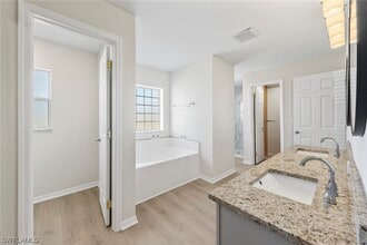 Building Photo - 4BR Home in Gated Town Lakes Community with Lake View