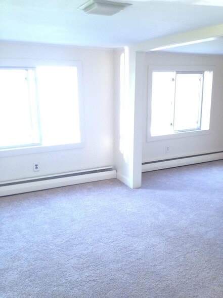Living room with windows to the lake - 1157 S Belfast Ave