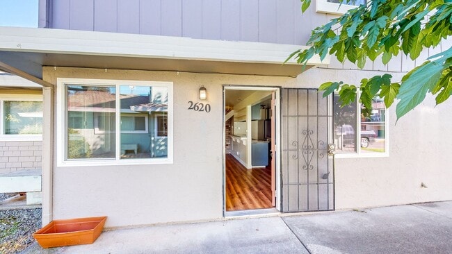 Building Photo - 2 story 2 bedroom 1 bath condo with covered parking, private storage and community pool!