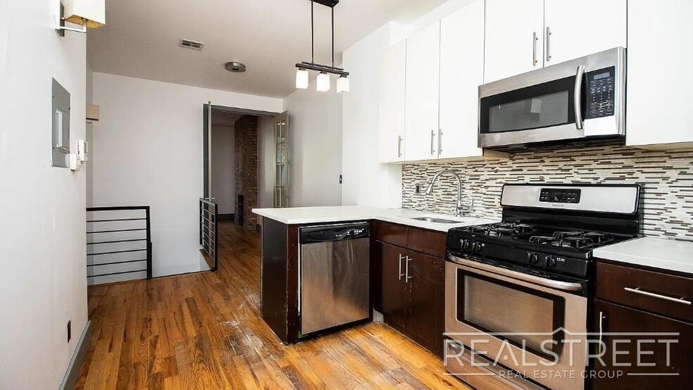 Building Photo - Gut-Renovated 3BR + Massive Finished Basement | Backyard, Laundry & HVAC | Bushwick