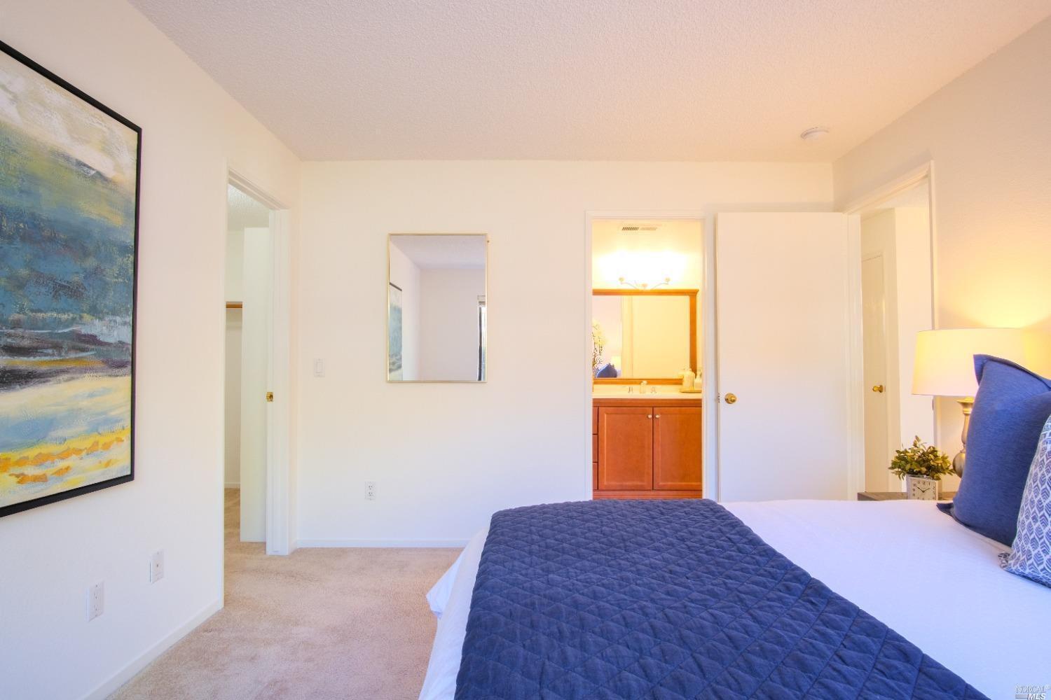 Primary bedroom with a walk in closet - 15 Hector Ln