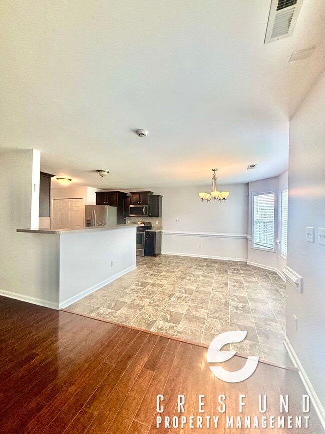 Building Photo - Freshly Painted and Spacious 4 Bedroom, 3 ...
