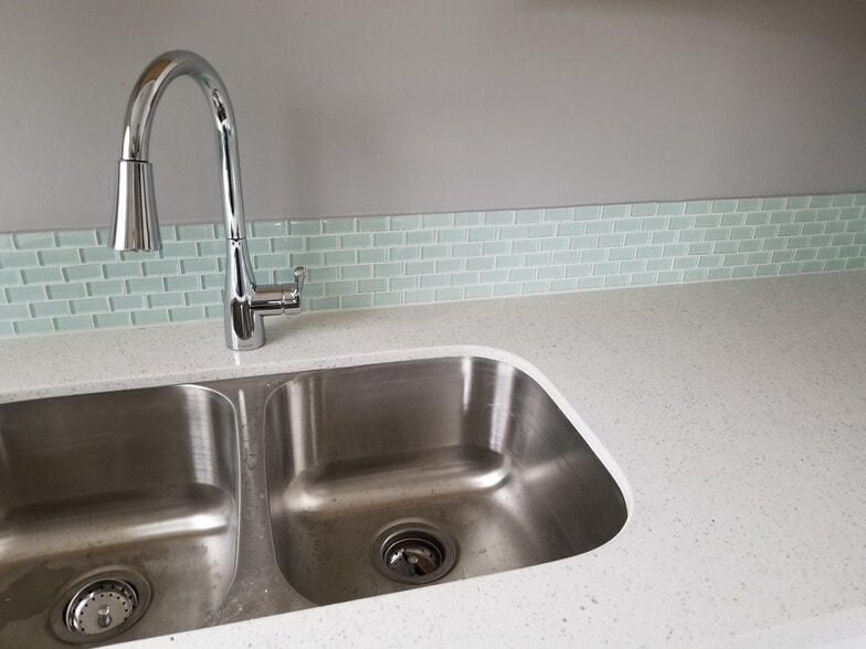 Aqua tile backsplash with new quartz counters. - 5442 -5448 SE Franklin St