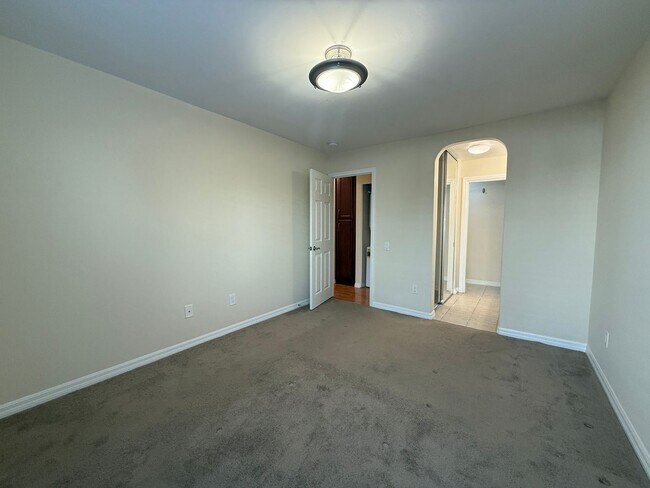 Building Photo - Upgraded Condo with Private Patio, AC, Pool, Gym, and Covered Parking in Gated Community