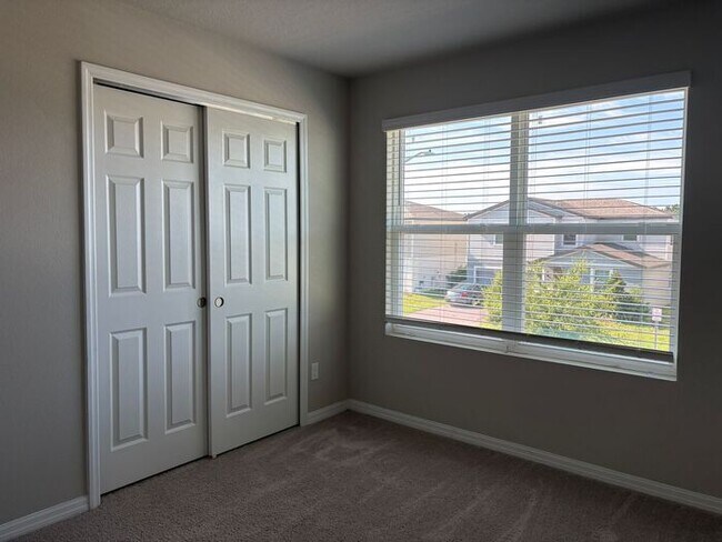 Building Photo - Like-New 4 Bedroom 3 Bath with Pond View & Two Living Spaces — Minutes to South Lake Nona