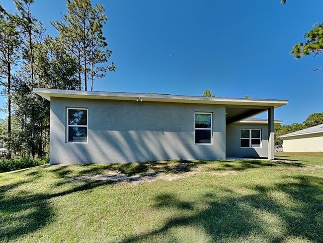 Building Photo - 7669 N Paris Dr