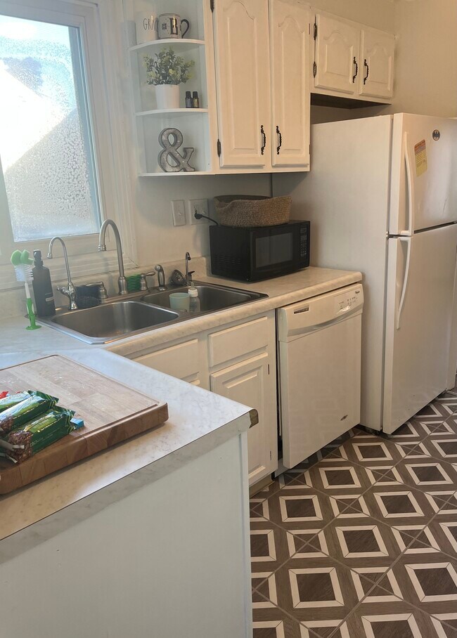 Kitchen windows face backyard and deck - 141 Lagrange St