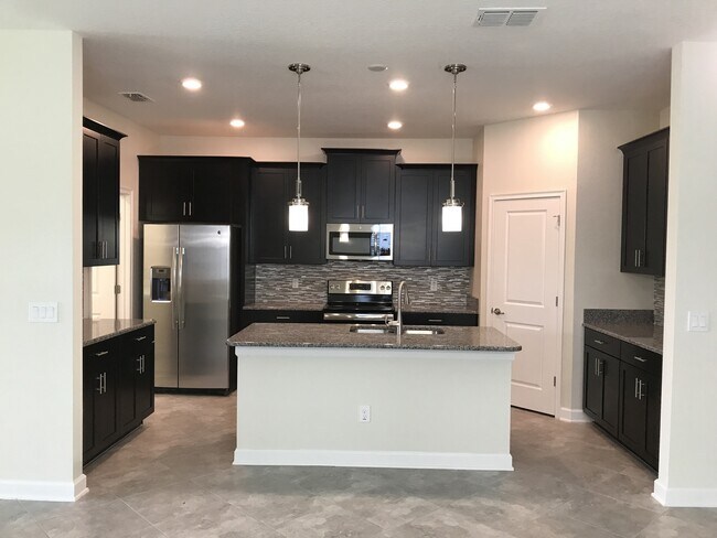 Building Photo - Just Listed! Newer 4/3 Home at The Oaks in...