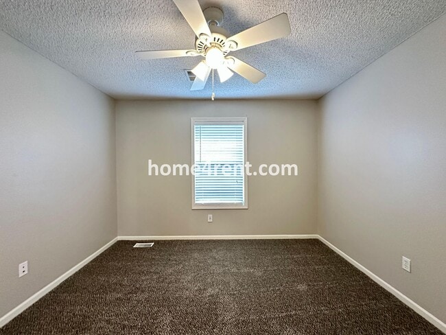 Building Photo - Beautiful Four-Bedroom Home with Three Car Garage, Wood Floors, Finished Basement and a Fenced Ya...