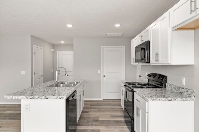 Building Photo - 4 bedroom home with a fenced in yard!