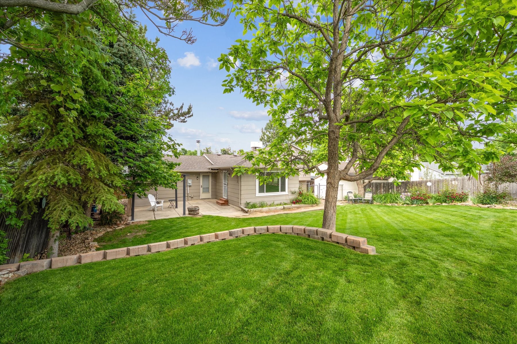 Beautiful Backyard with Flower Gardens - 9385 Carr St