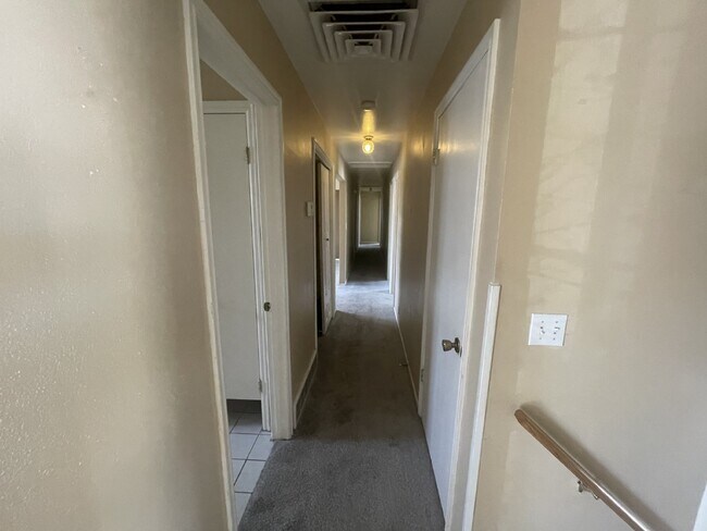 Building Photo - Spacious 6-Bed Oasis with Finished Basement & Cozy Fireplace.