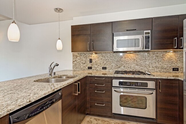 Building Photo - Modern Downtown Condo in Premier High-Rise...