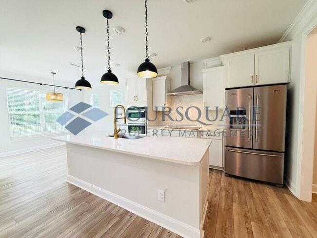 Building Photo - End-Unit Townhome with Fenced Yard, Washer/Dryer included & 2-Car Garage – Comfortable & Convenie...