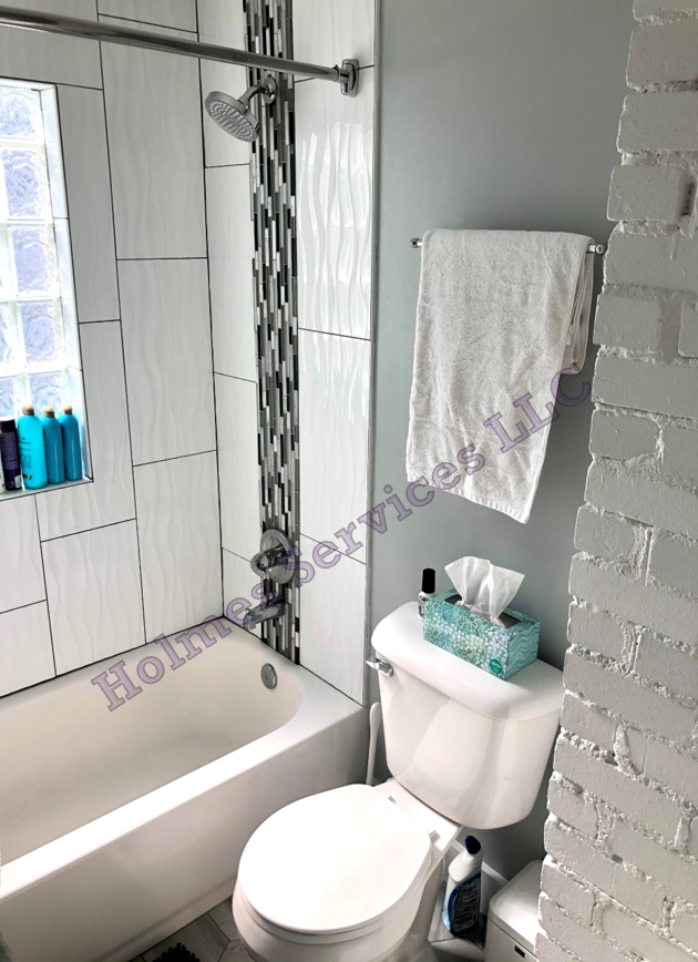 Unique custom tile in updated bath. - 526 Academy St