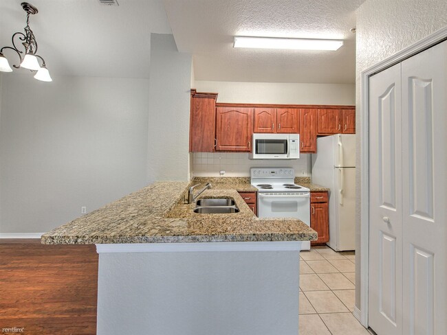 Building Photo - 2 br, 1 bath Condo - 5703 Legacy Crescent ...