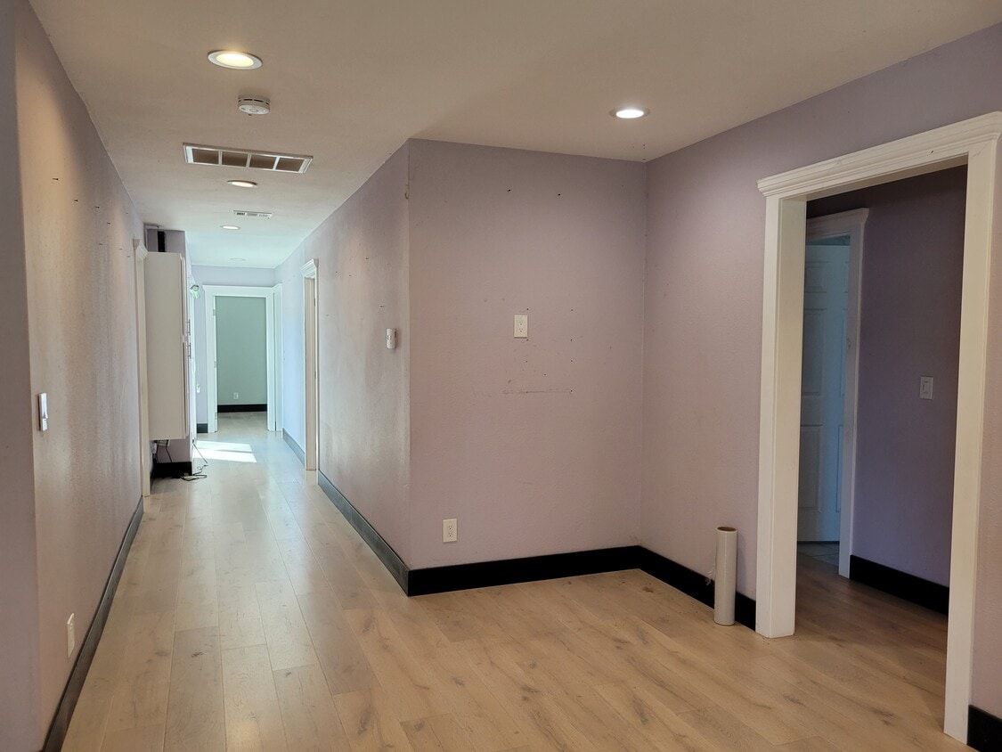Hall way to bedroom 4 and on the right side to bedroom 1. - 11721 Puryear Ln