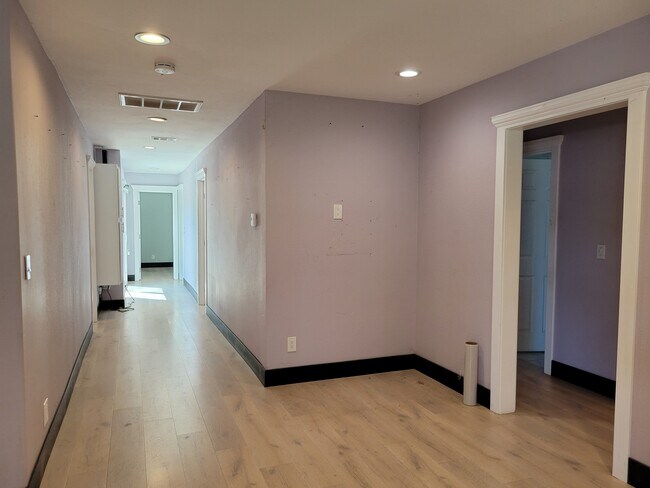 Hall way to bedroom 4 and on the right side to bedroom 1. - 11721 Puryear Ln