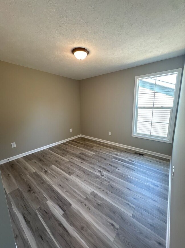 Building Photo - Charming New Home with a Rocking Chair Front Porch!