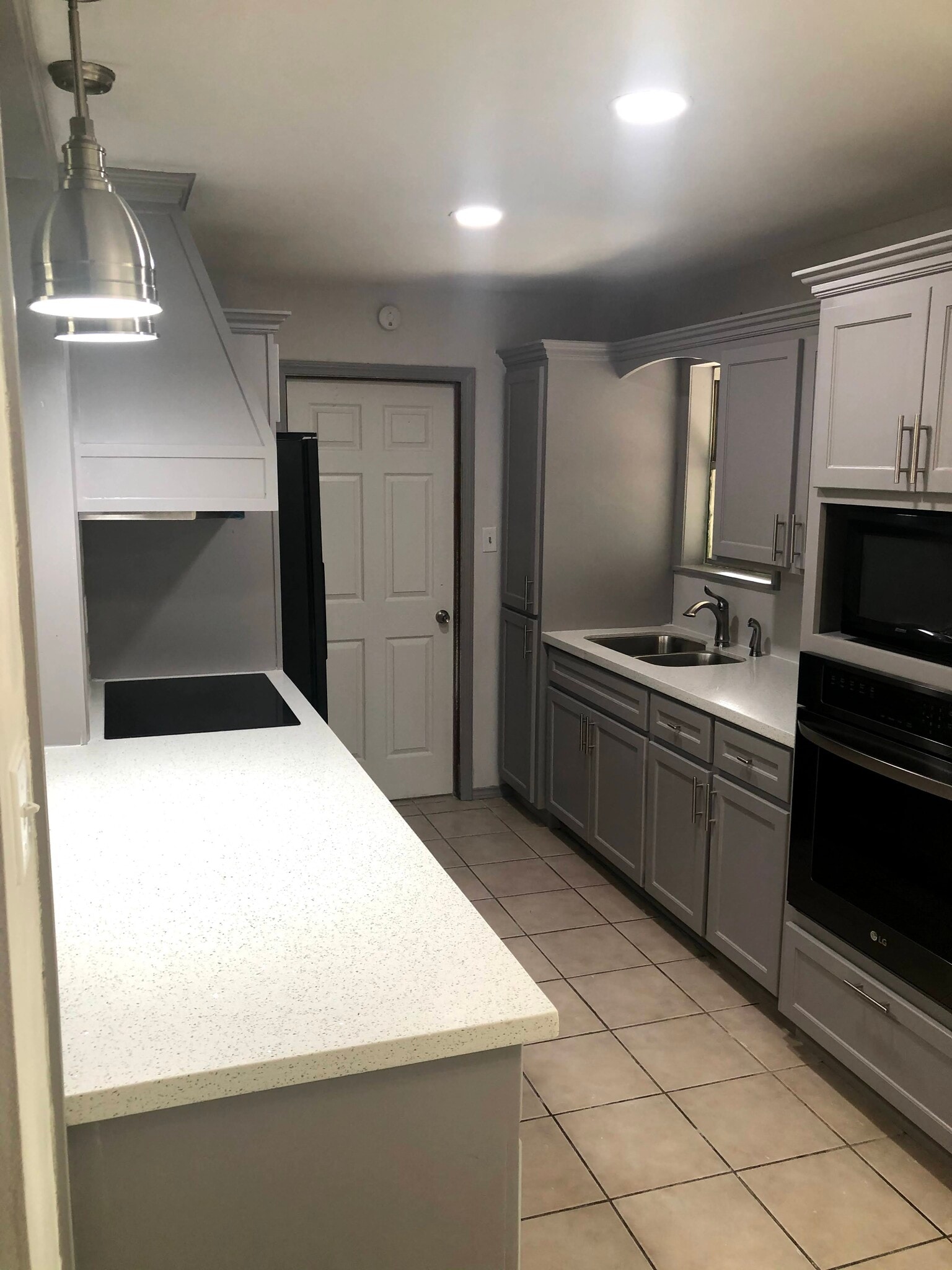Remodeled kitchen with Quartz counter tops. New custom cabinets and pantry. New oven and stovetop. - 601 E Williamson Ave
