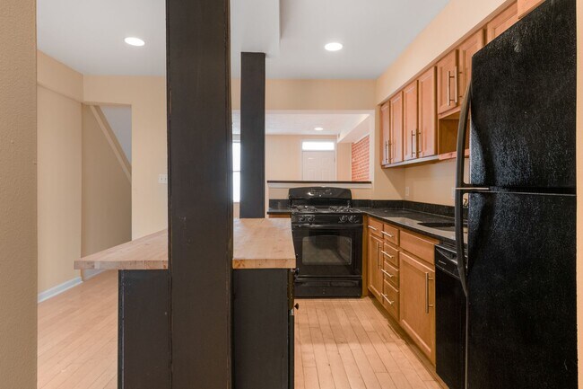 Building Photo - Spacious 2BR/2.5BA Townhome with Finished Basement & Extra Storage