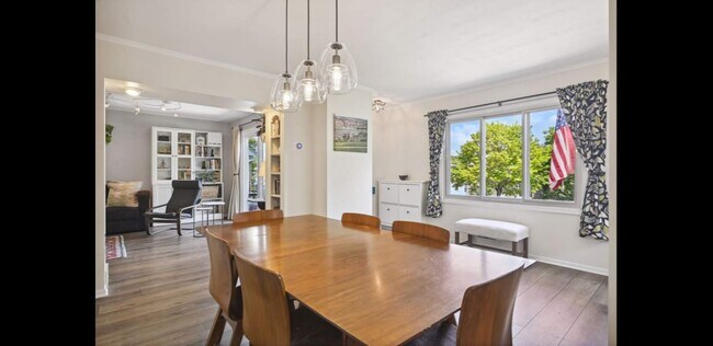 Light and bright main floor w/ large windows & sliding glass doors letting in tons of natural light - 2740 Alabama Ave S