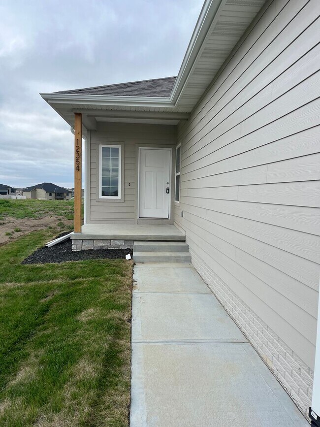 Building Photo - Brand-New Ranch in Papillion | 4BR + Finished Basement + Deck + All-Inclusive Amenities