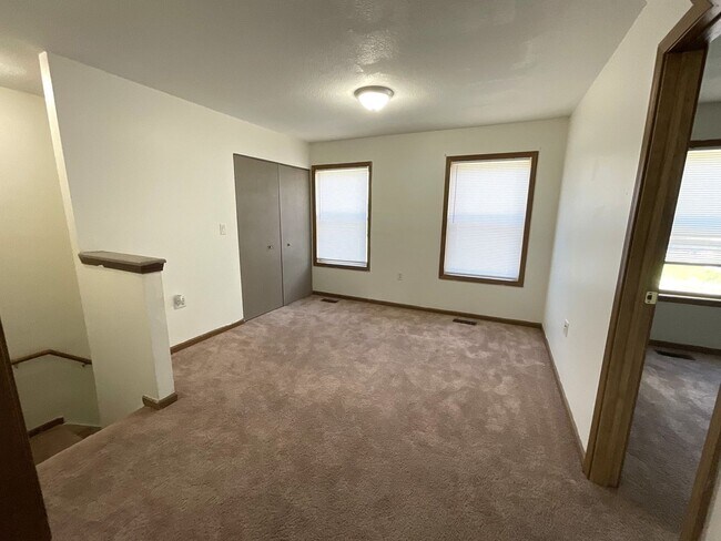 Building Photo - For Rent - 4 Bedroom, 2 Full Bath Home with Ground-Floor Bedroom, Attached Garage and Brand-New K...