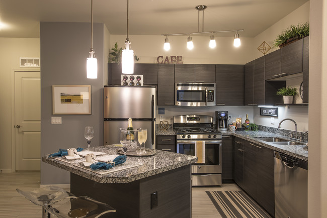 Kitchens feature sleek stainless steel appliance package and USB ports. - Liv Ahwatukee