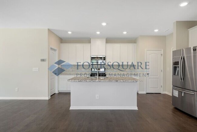 Building Photo - End-Unit Townhome with Loft, Open Floor Plan & Patio, Conveniently Located Near Dining, Shopping,...