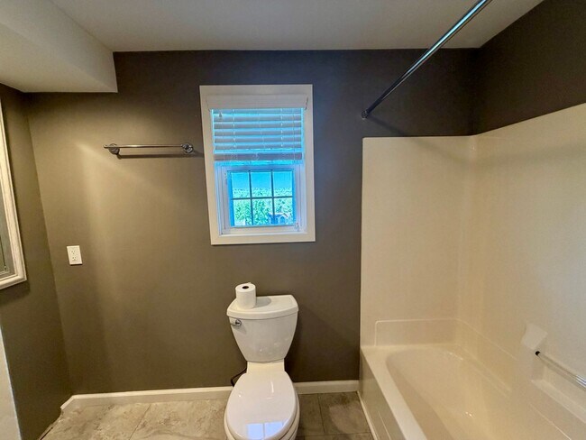 Building Photo - Modern Comforts Await: Spacious Rental with 2-Car Garage, Private Office, and Finished Basement w...