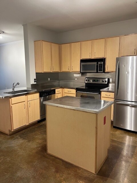 Kitchen with stainless countertops and appliances - 1803 Broadway