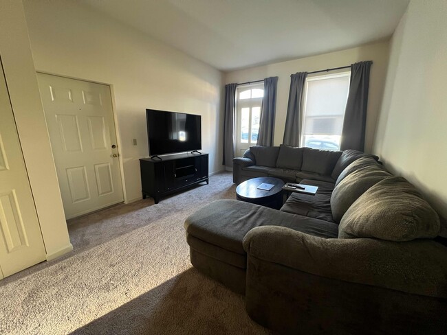 Large living room that fits a huge sectional with room to spare. - 906 Russell Blvd