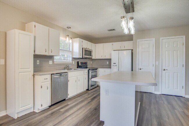 Building Photo - Live the Gulf Breeze Waterfront Life – Dock, Canal Access & Boat Lift!