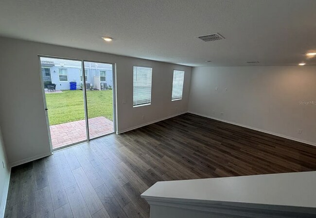 Building Photo - "Spacious 3-Bedroom Townhouse with Granite Elegance in St. Cloud – 4543 Rangeland Way"