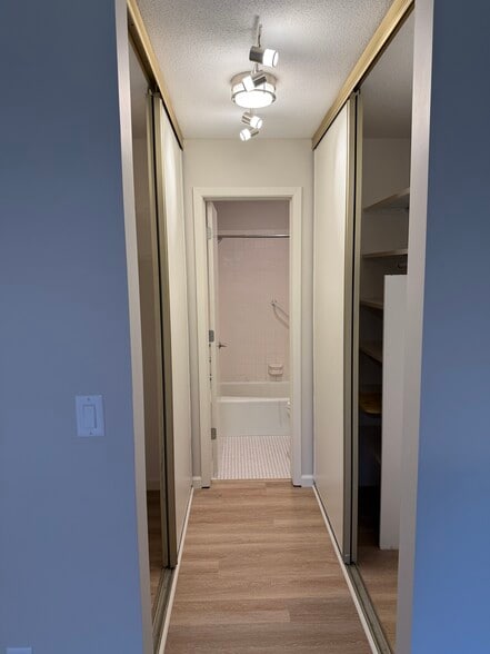 From Master Bedroom Walk Im Closet Looking Into Shower & Toilet Room - 9400 Old Cedar Ave S