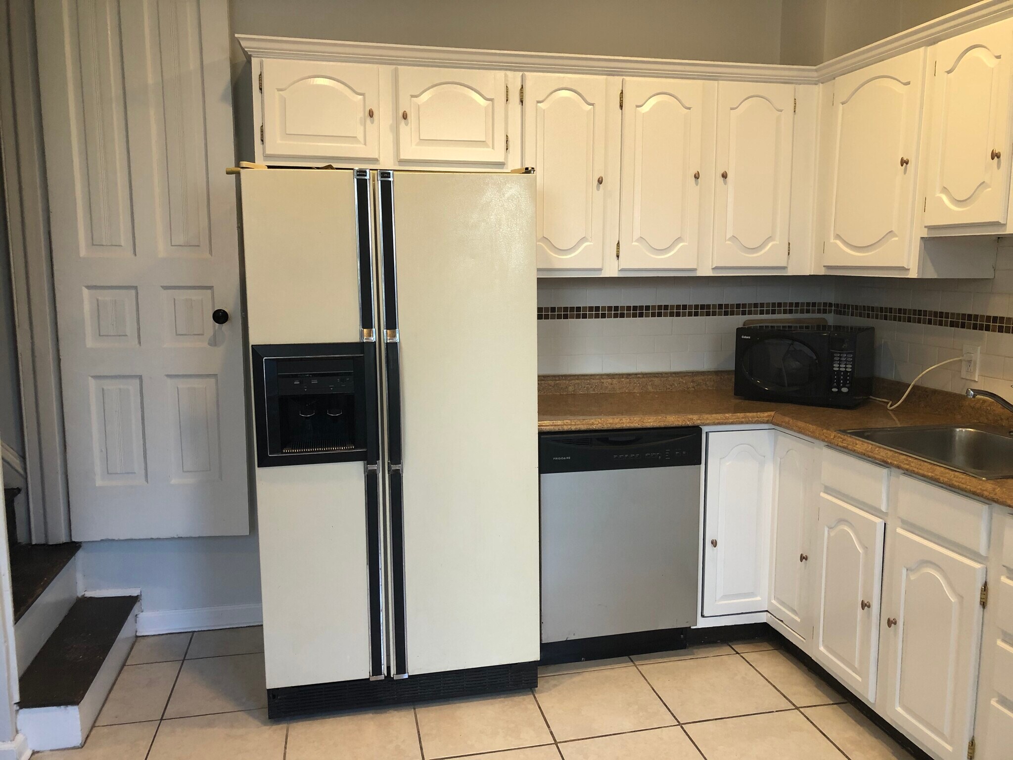 Kitchen with Side by Side Fridge, Stainless Steel Dishwasher - 263 West Rittenhouse Street
