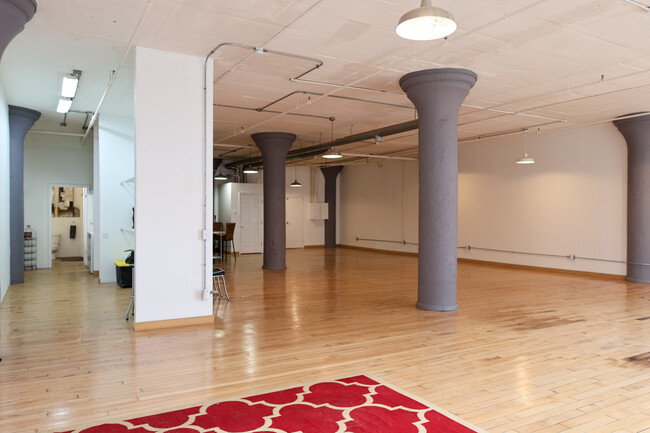 HUGE flared concrete columns stand as sculptural reminders of the building's century-old industrial - 1709 Washington Ave