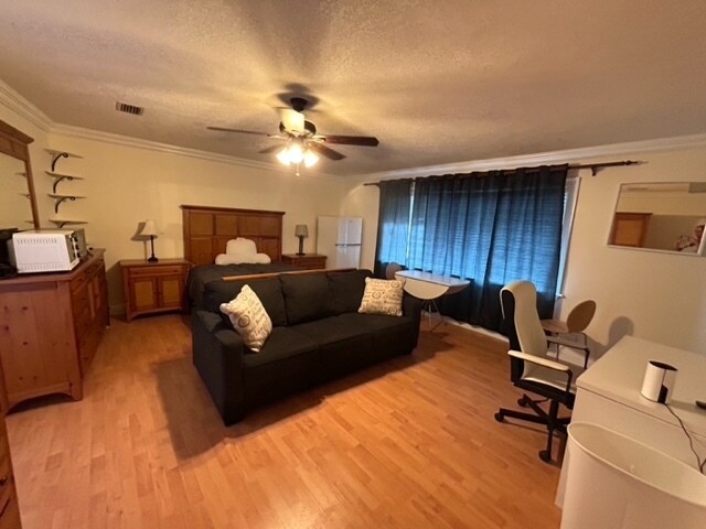 large master room with queen bed set, table & chairs, couch - 600 NW 7th Ave