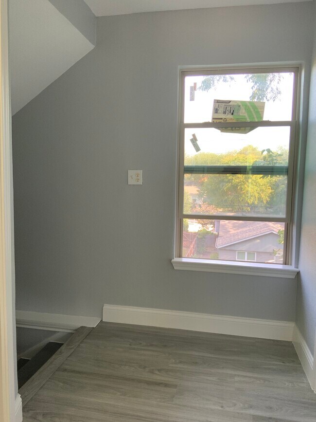 Window overlooking backyard/ landing at the top of stairs - 3816 Byers Ave