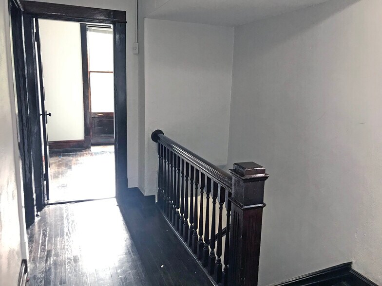 Detailed staircase with view into bonus room - 4125 Juniata St