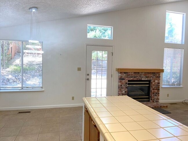 Building Photo - Coming Up Roses - NW Reno 4 Bedroom/3 Car Garage Single Story House