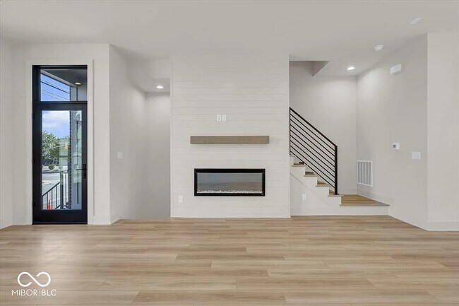 living area with fireplace - 675 E 16th St