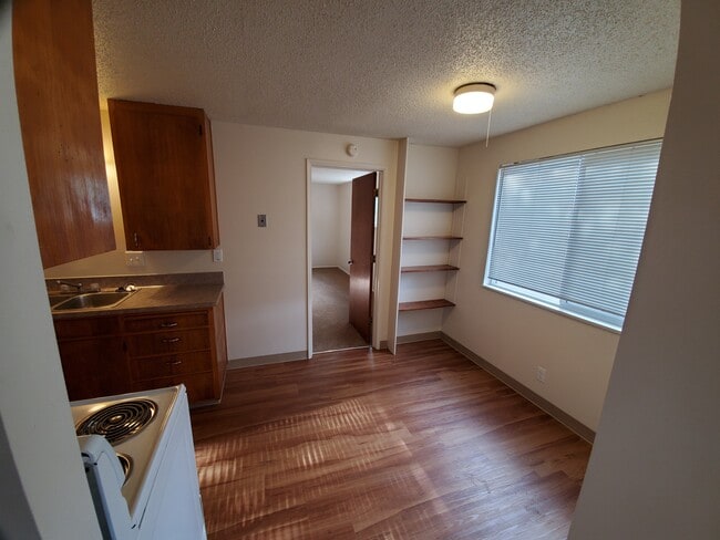 1 Bedroom Kitchen & Dining Room from Family Room - Wolfpack Village Apartments