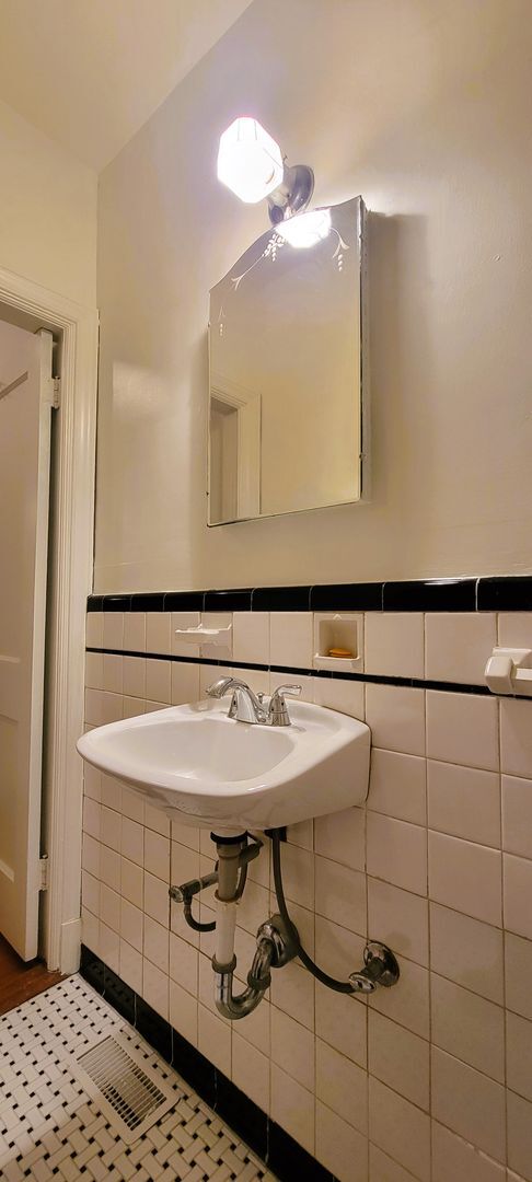 Building Photo - Remodeled brick bungalow with 1st floor li...